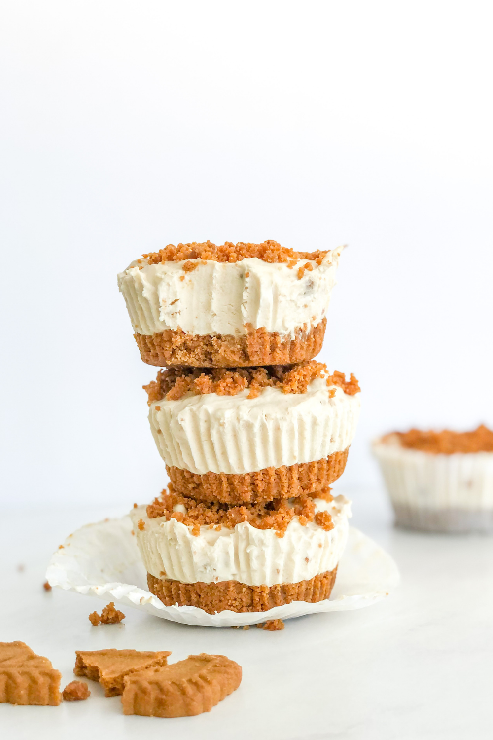 stack of mini biscoff cheesecakes with a lotus biscoff cookie beside it