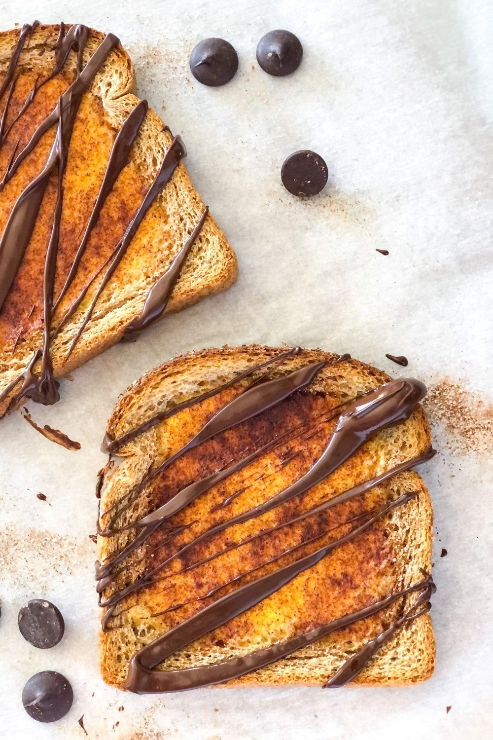 churro custard toast with melted chocolate drizzle