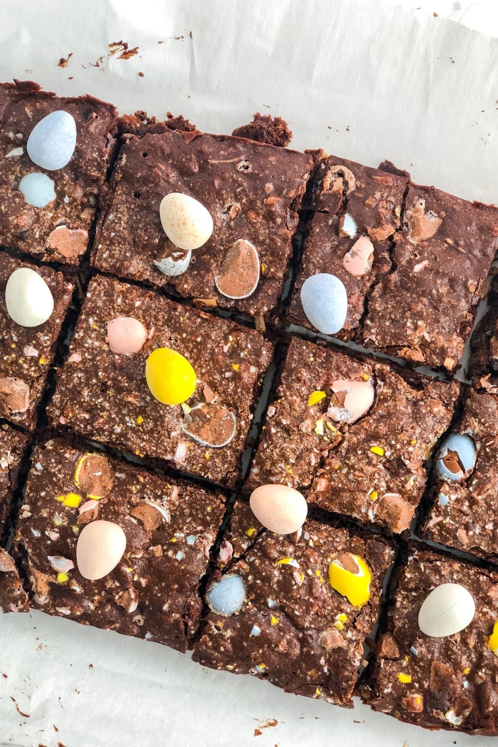 sliced Cadbury mini egg brownies on parchment paper