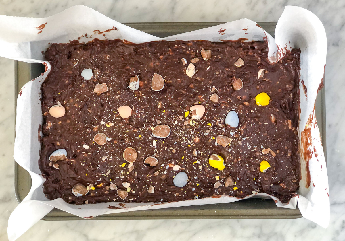 baked brownies in a nonstick baking pan with parchment paper