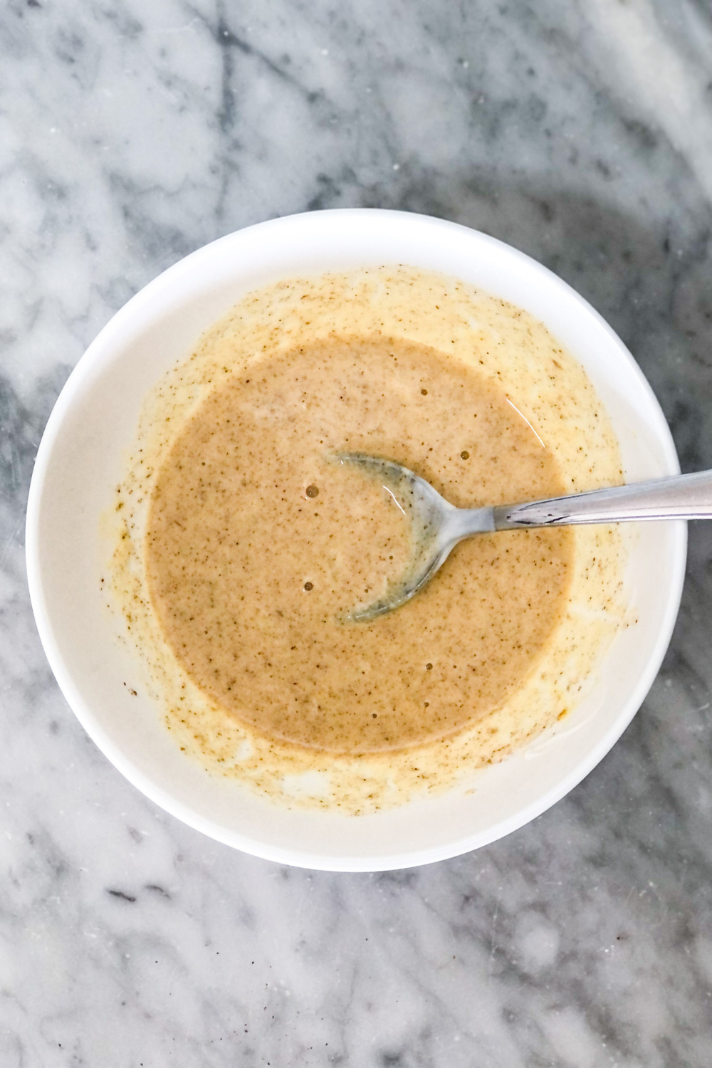 chai custard ingredients mixed in a bowl