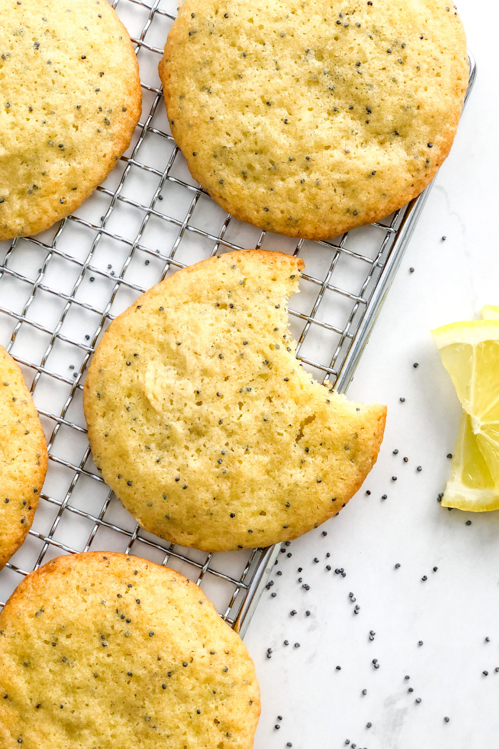 soft lemon poppy seed cookies on a wire cooling rack