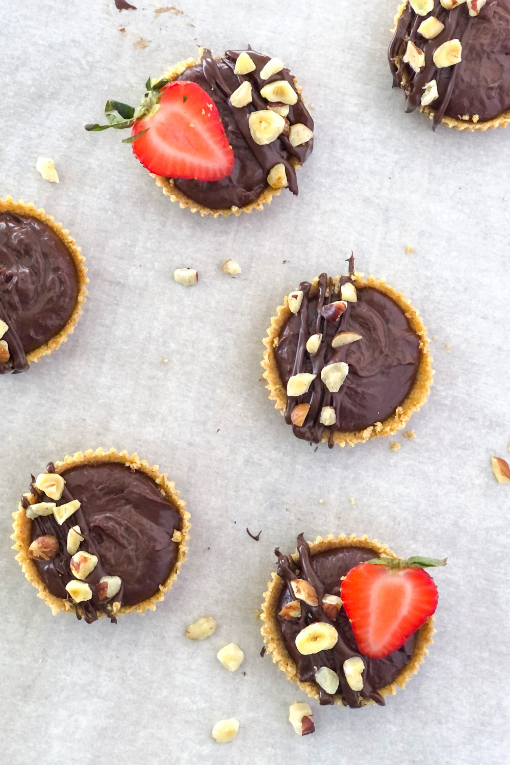 mini chocolate nutella tartlets with strawberries and hazelnuts