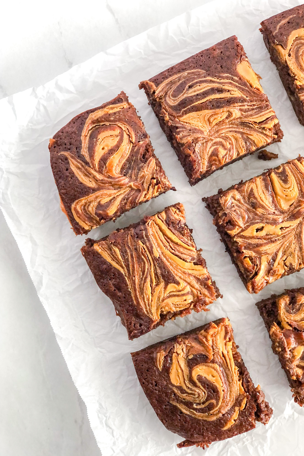 sliced brownies on parchment paper