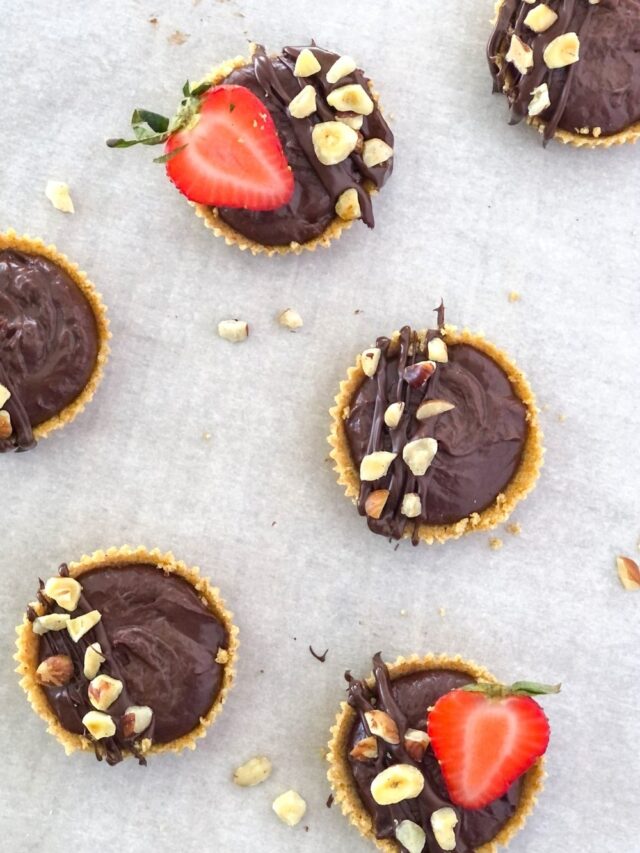 mini chocolate nutella tartlets with strawberries and hazelnuts