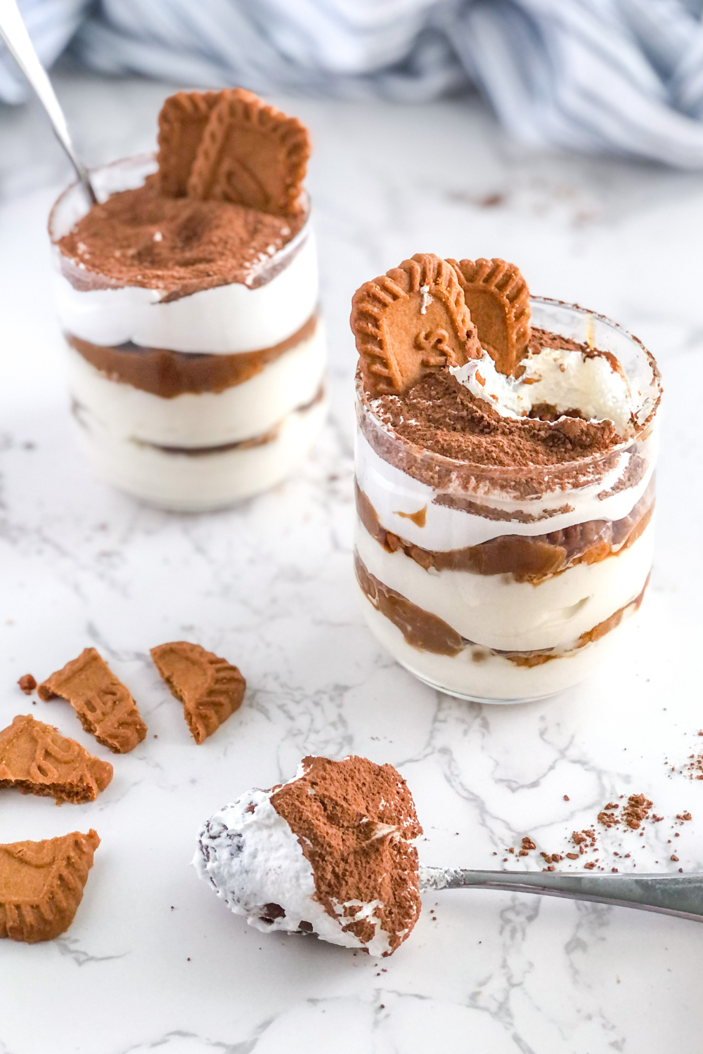 Biscoff tiramisu cups with yogurt and mascarpone, with a spoonful of tiramisu in front