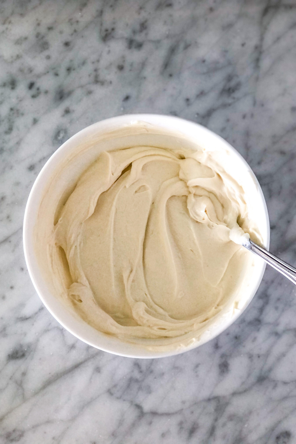 mascarpone cheese and Greek yogurt mixture in a white bowl