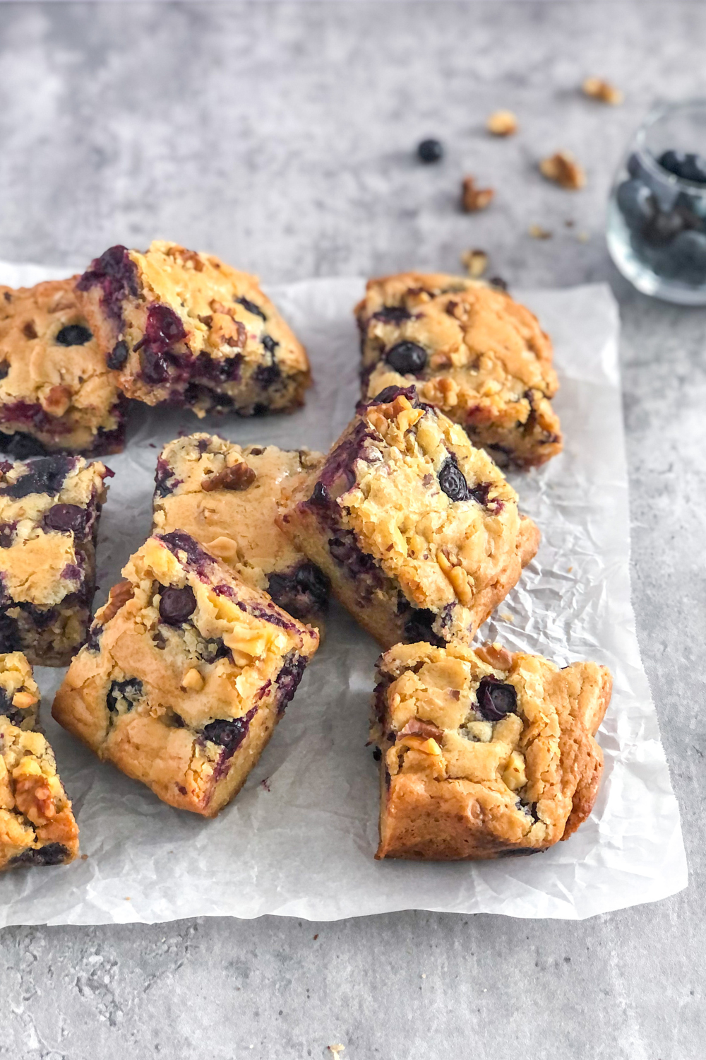 blueberry walnut blondies on parchment paper