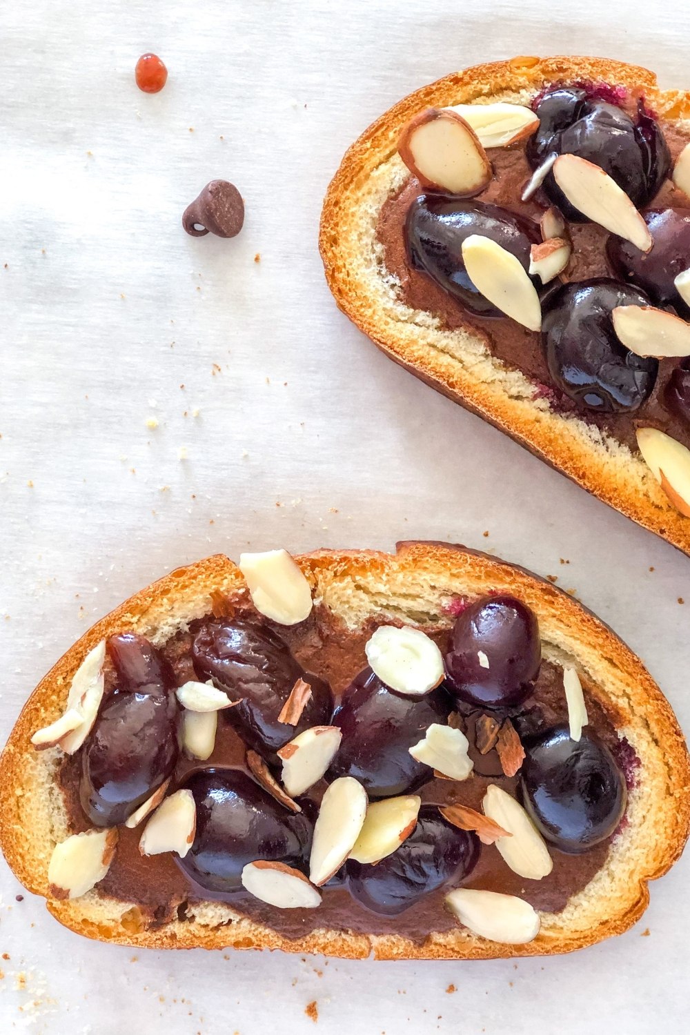 tiktok yogurt toast with cherries and almonds on parchment paper