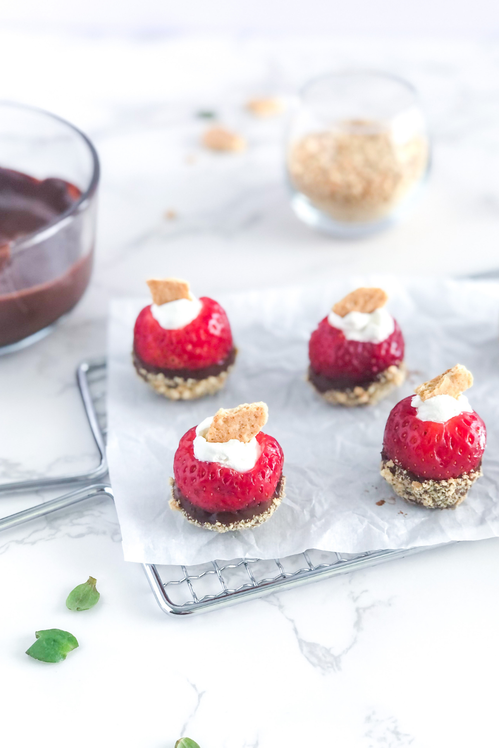chocolate Nutella covered strawberries with whipped cream and graham crackers