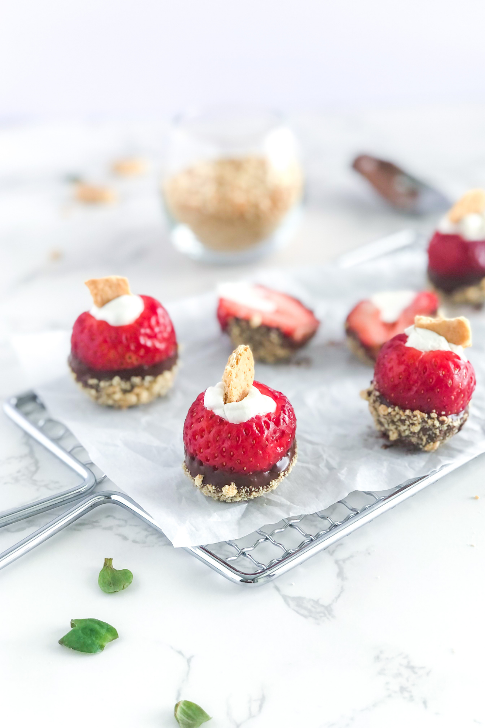 chocolate Nutella strawberry bites on parchment paper