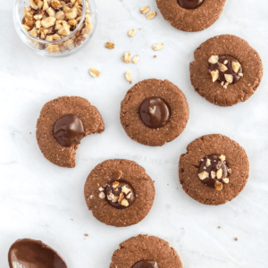 no bake Nutella thumbprint cookies with oat flour and chopped hazelnuts