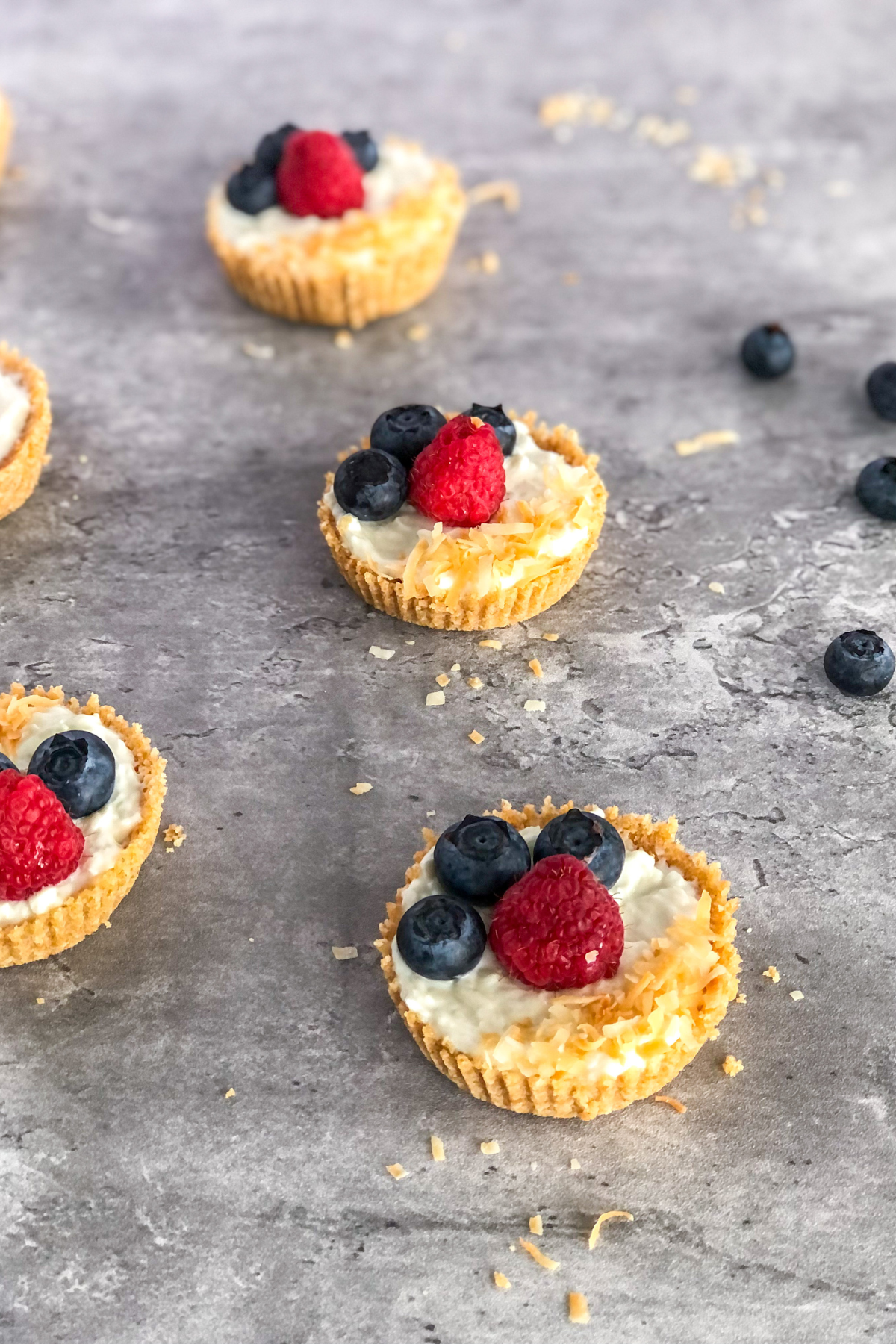 mini tarts with graham cracker crust topping with berries