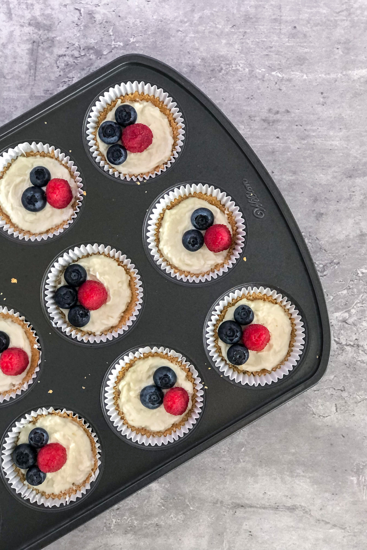 mini no bake berry tarts in a muffin tin