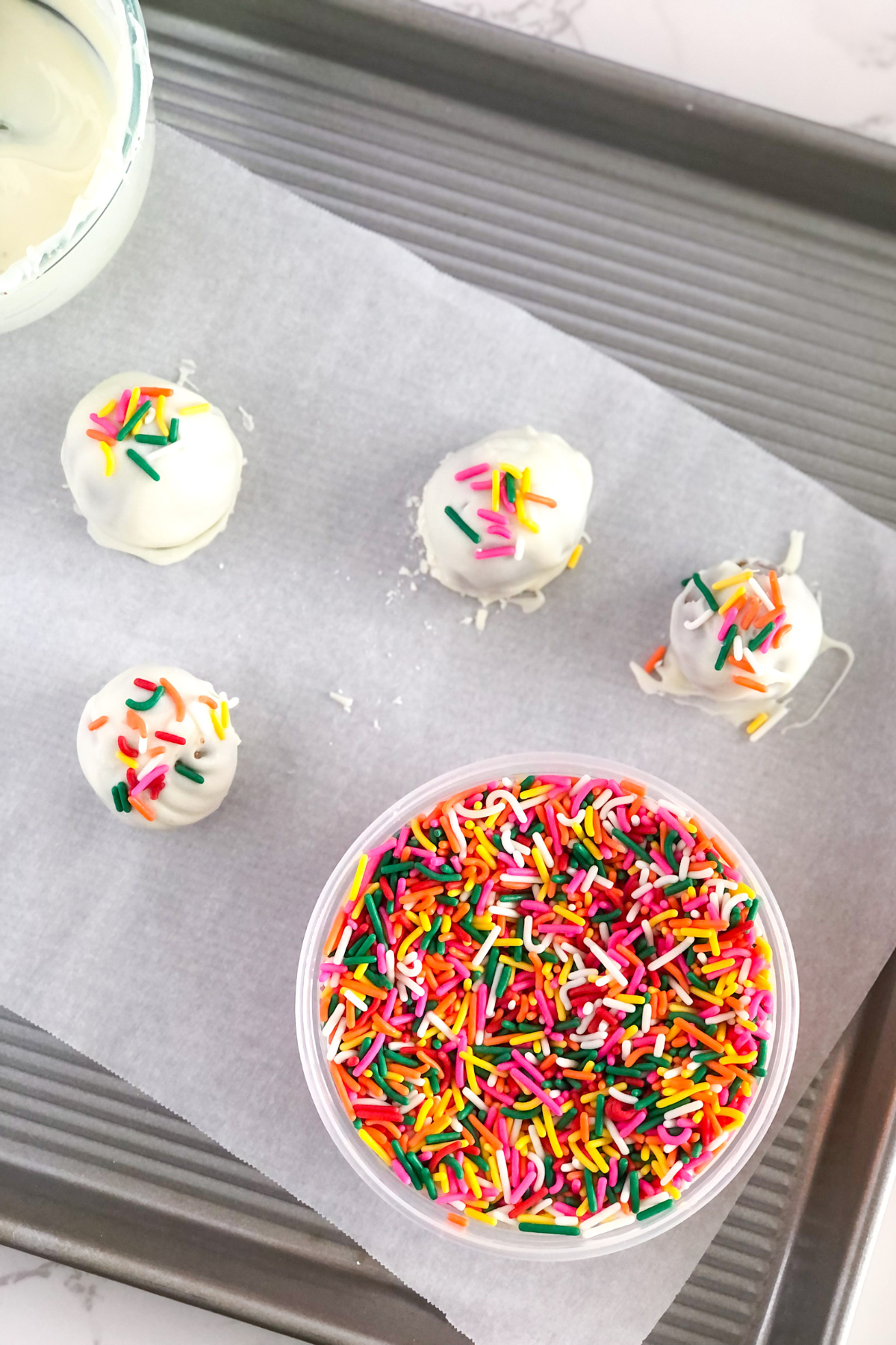 sprinkles in a bowl with birthday cake truffles
