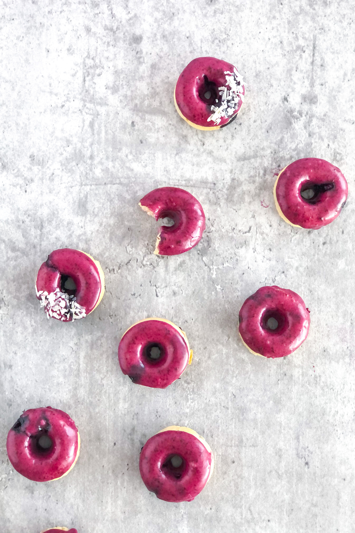 mini blueberry baked donuts topped with shredded coconut