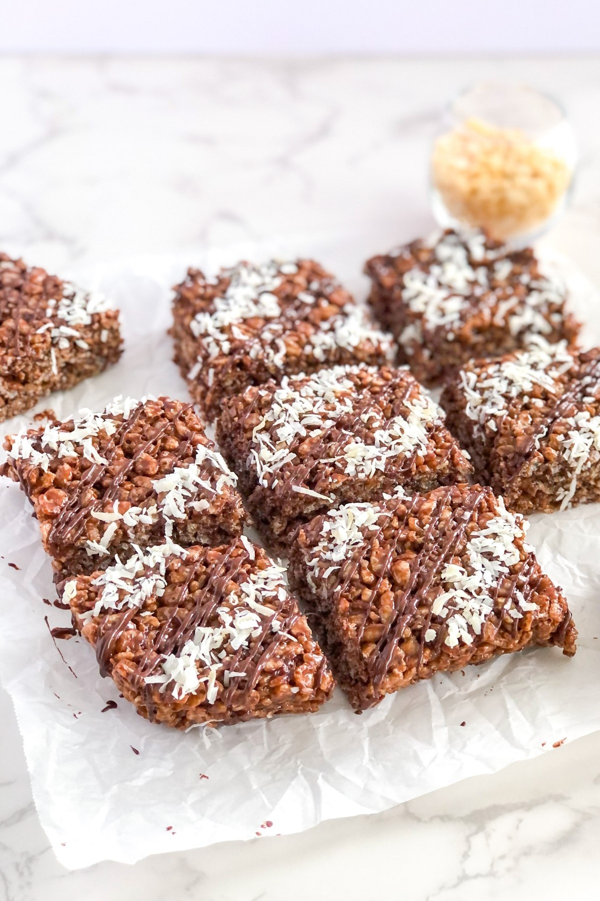 chocolate rice Krispie treats with shredded coconut on top