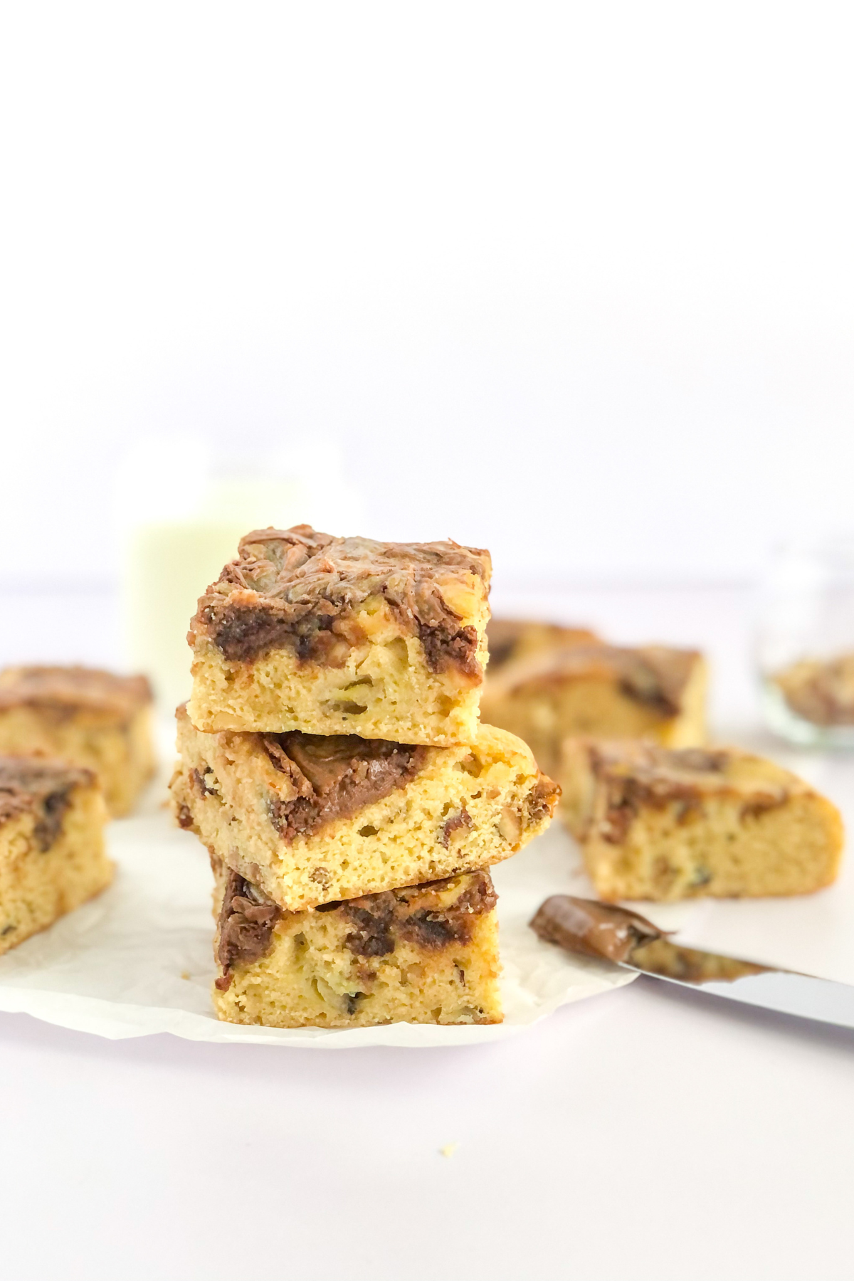 a stack of Nutella banana bread bars with hazelnuts