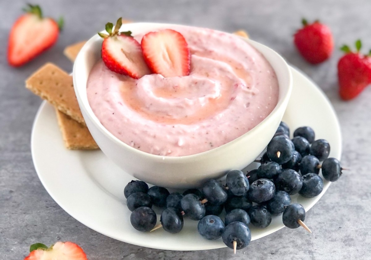 honey strawberry mascarpone dip with blueberries and graham crackers