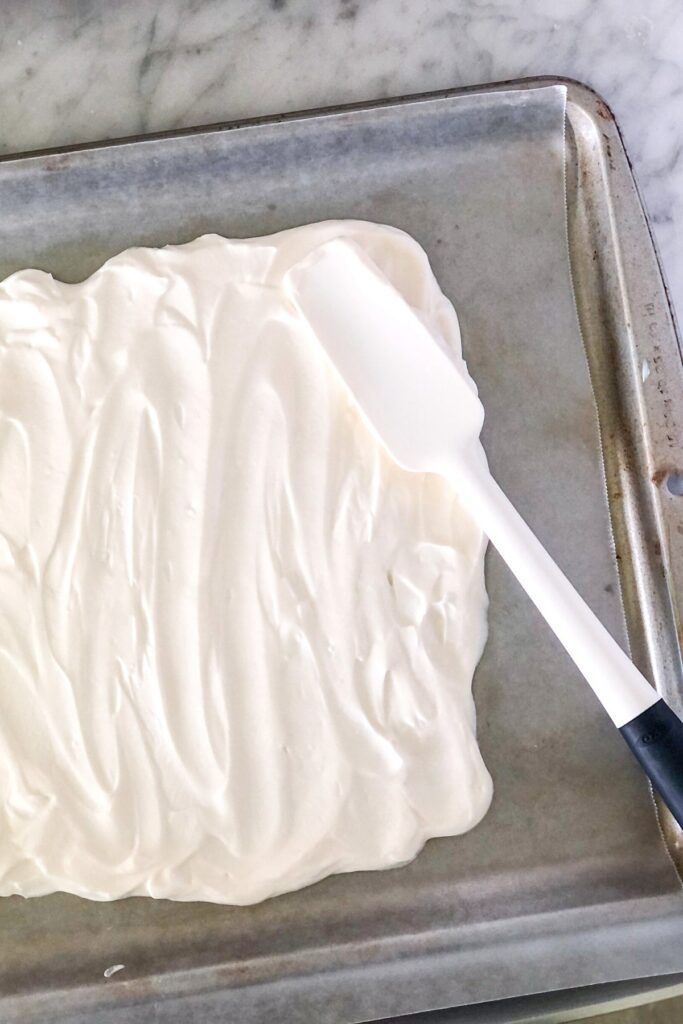 greek yogurt mixture spread out on sheet pan