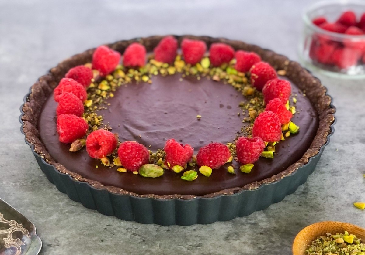 dark chocolate raspberry tart with pistachios