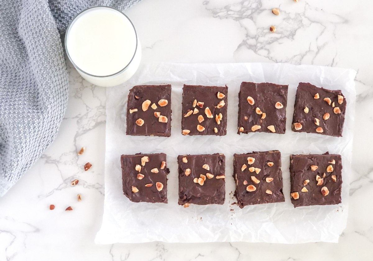 chocolate Nutella fudge with hazelnuts on parchment paper