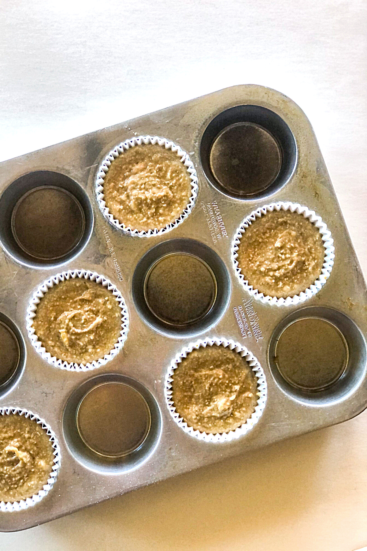 dog cupcake batter in a muffin tin