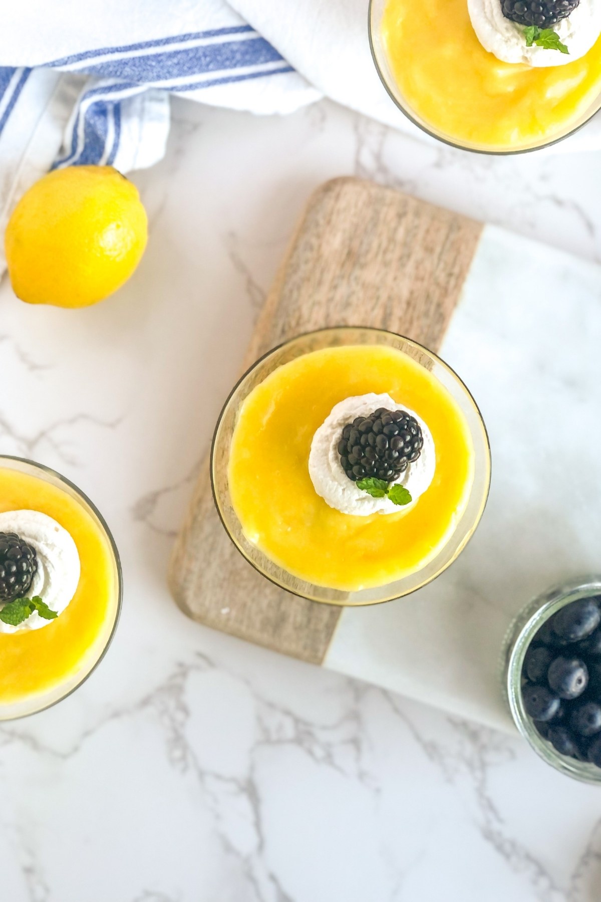 lemon parfaits with whipped cream and blackberries
