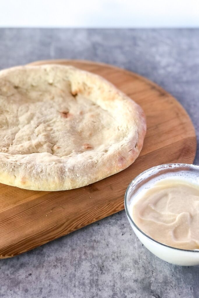 baked pizza crust with mascarpone mixture in a bowl