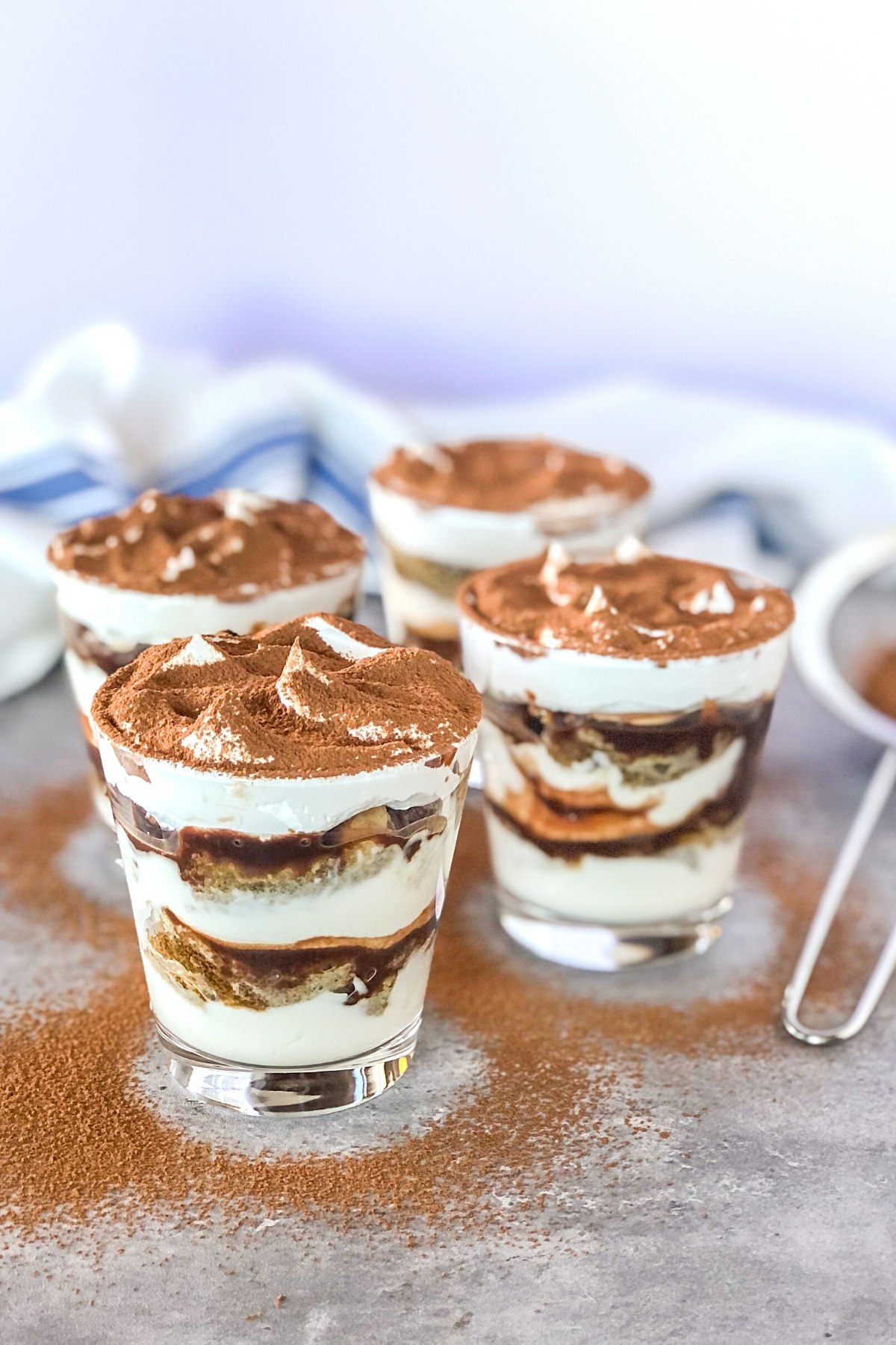 layered individual dessert parfaits with mascarpone, greek yogurt, coffee, ladyfingers, and hazelnut spread