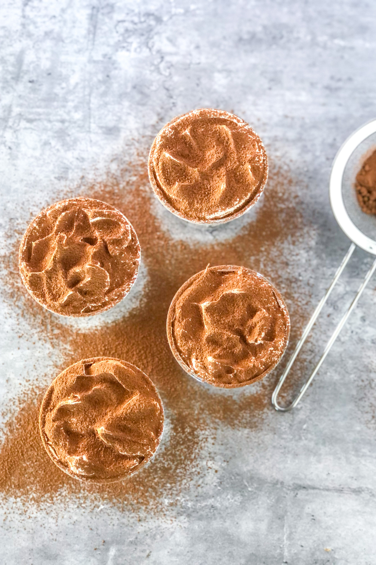 cocoa powder sifted over jars