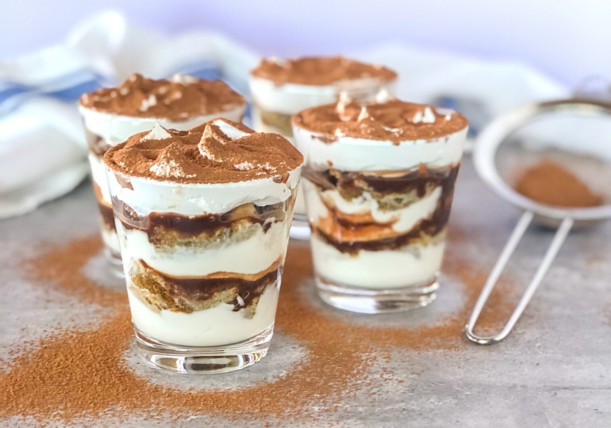 Nutella tiramisu jars with cocoa powder sifted on top