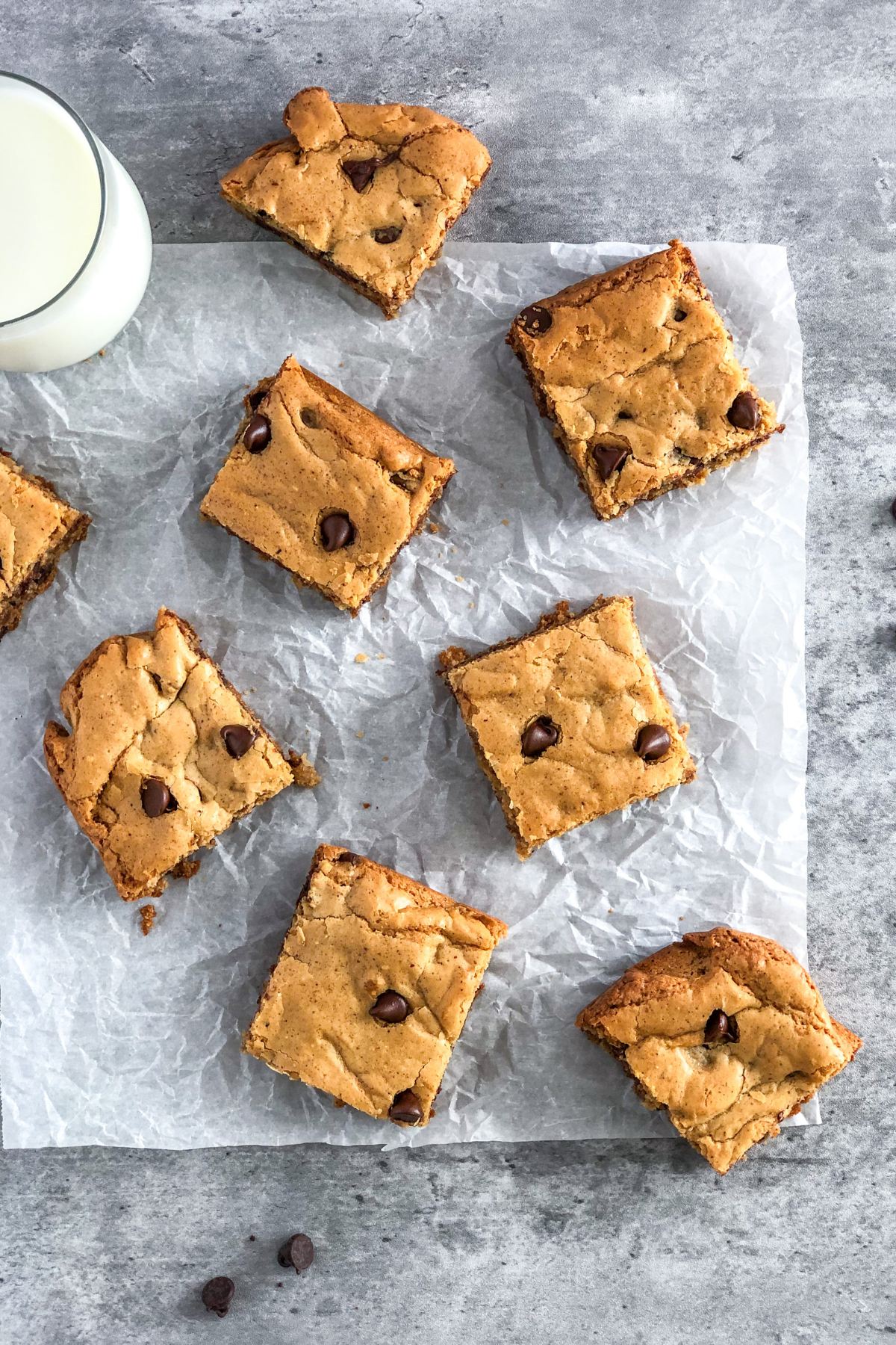 flat lay of cookie bars and a glass of milk