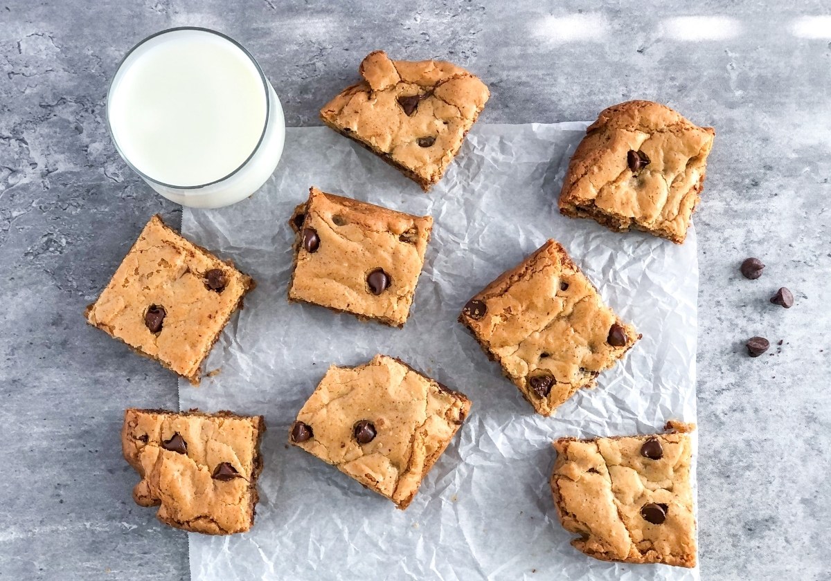chocolate chip almond butter cookie bars with a glass of milk