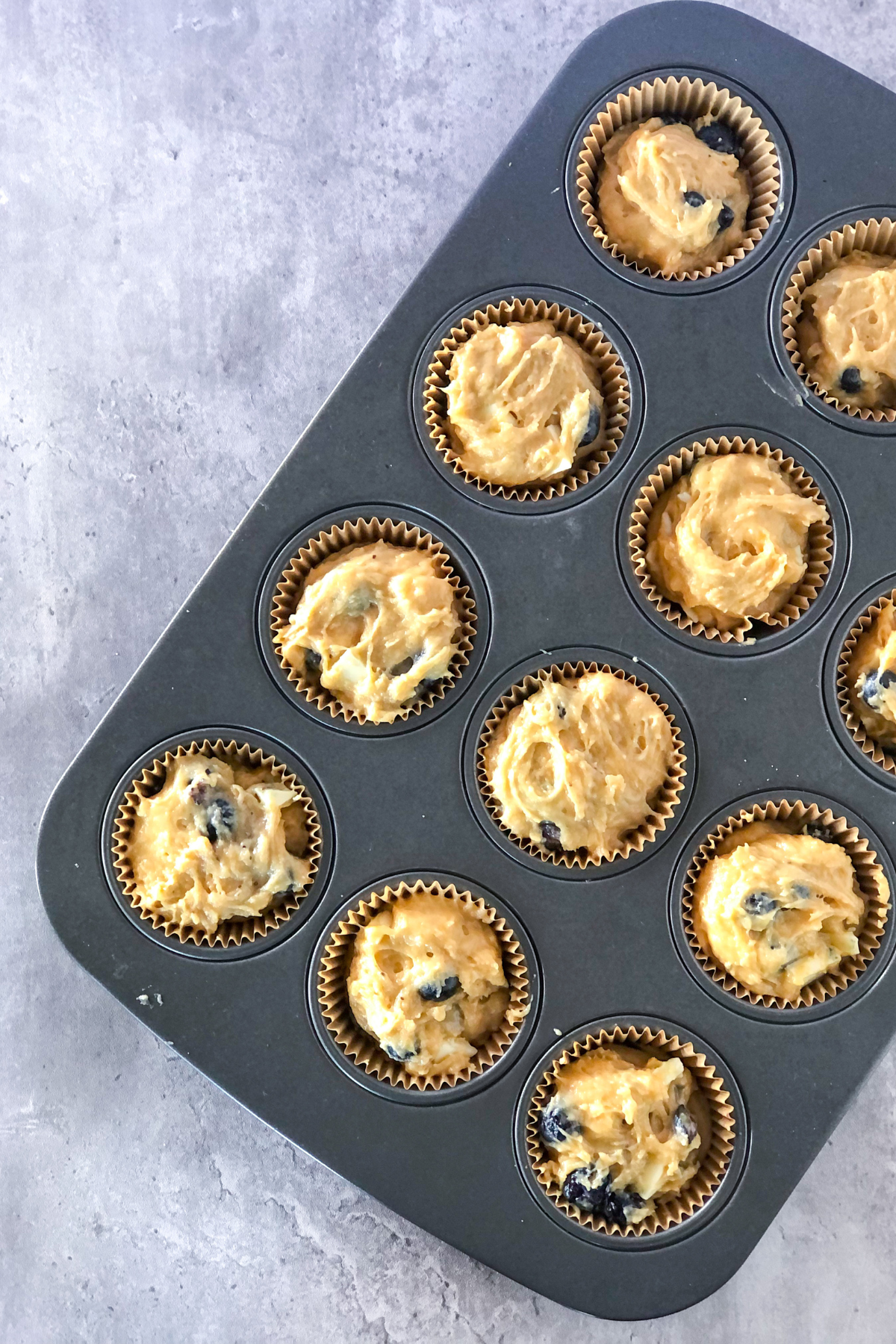 muffin batter in a muffin tin