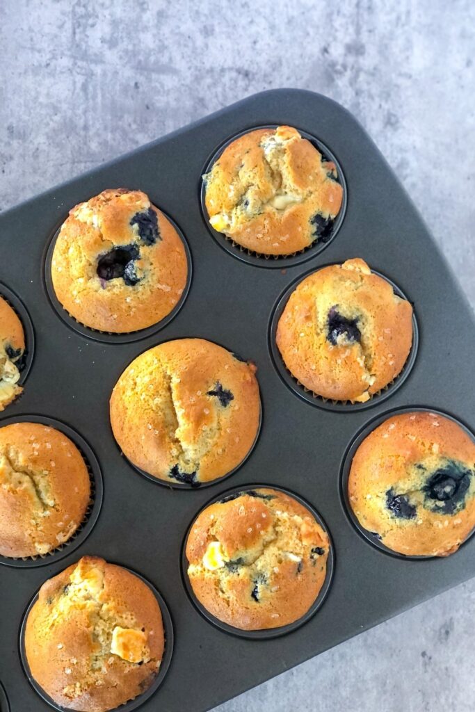 baked blueberry muffins in a muffin tin