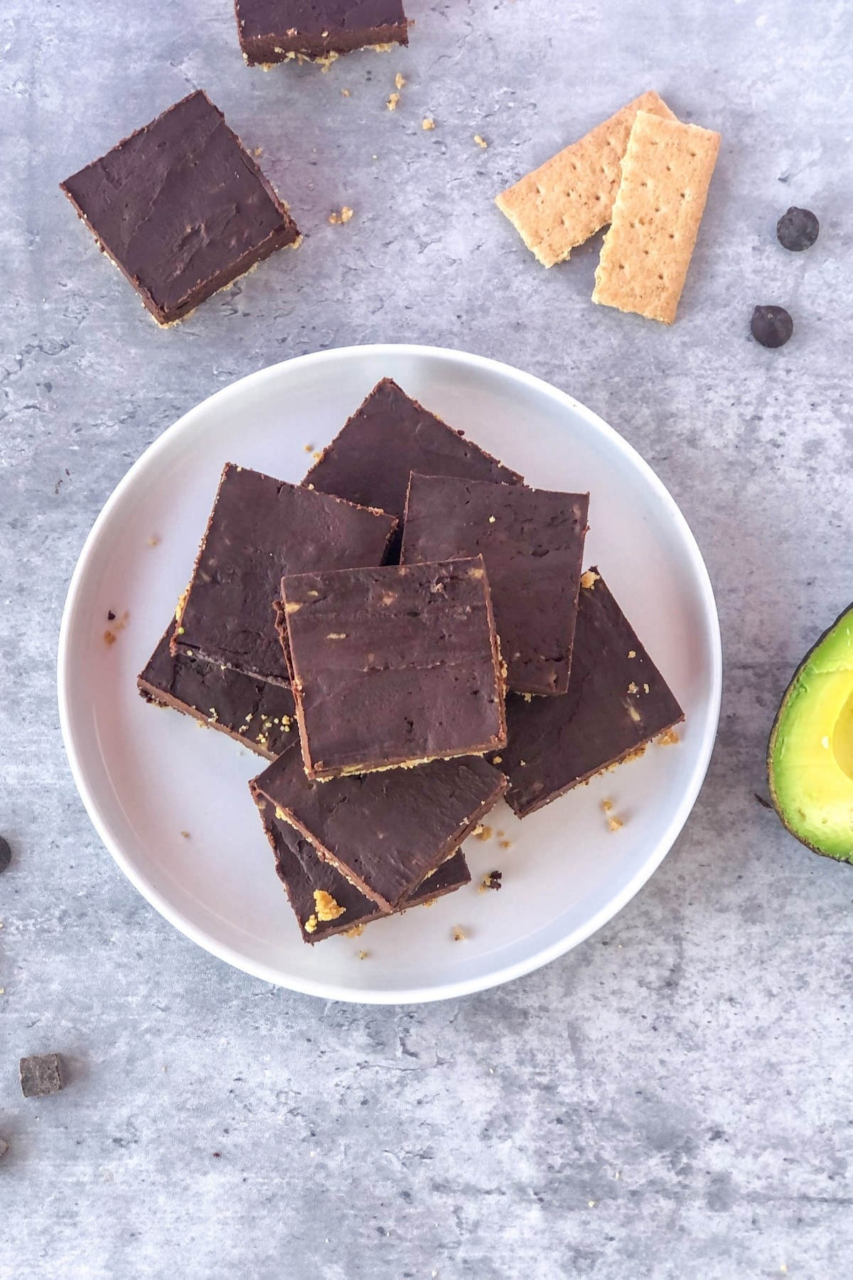 stack of chocolate avocado bars on a white plate