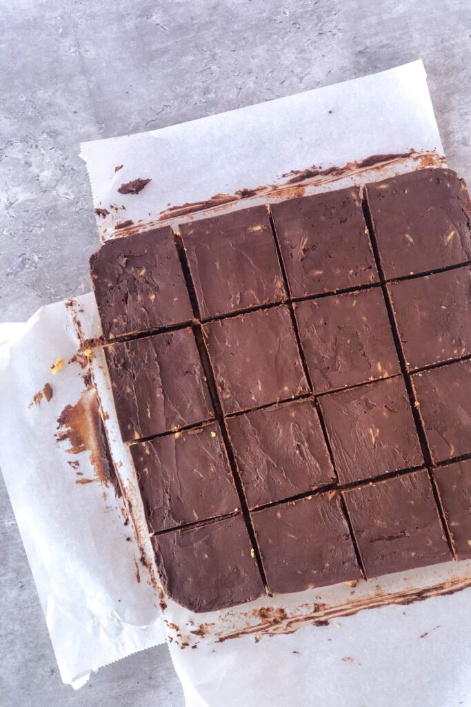 sliced chocolate avocado squares on parchment paper