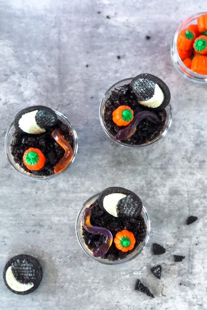 Oreo dirt cups topped with Halloween candy