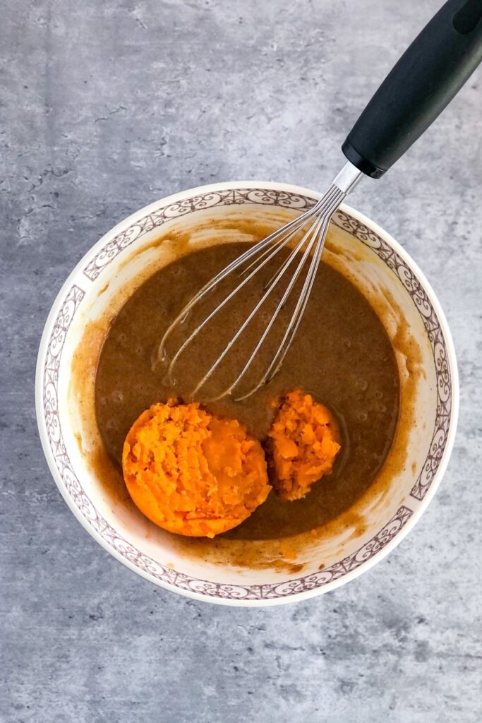 mashed sweet potato in a bowl with other blondie ingredients