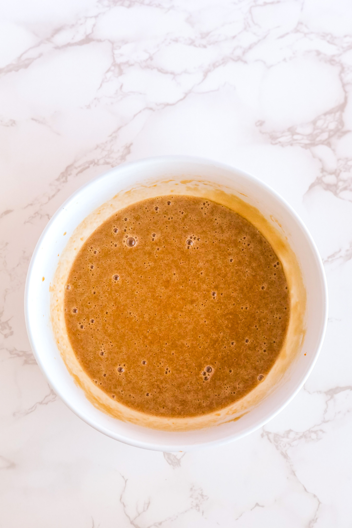 pumpkin batter in a white bowl