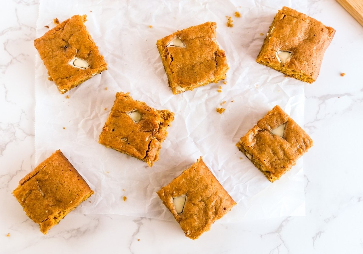 slices of pumpkin snack cake with white chocolate chunks