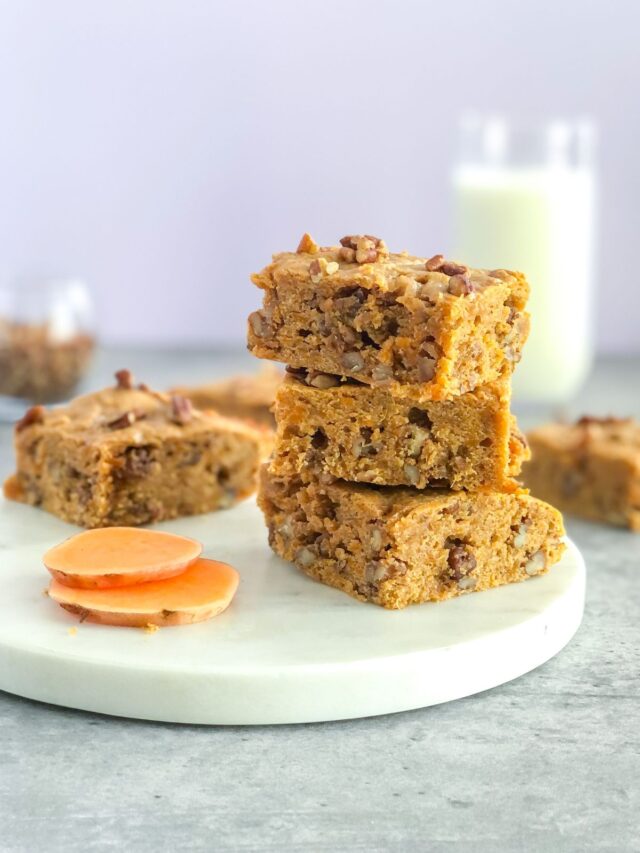 stack of sweet potato bars with pecans and a glass of milk