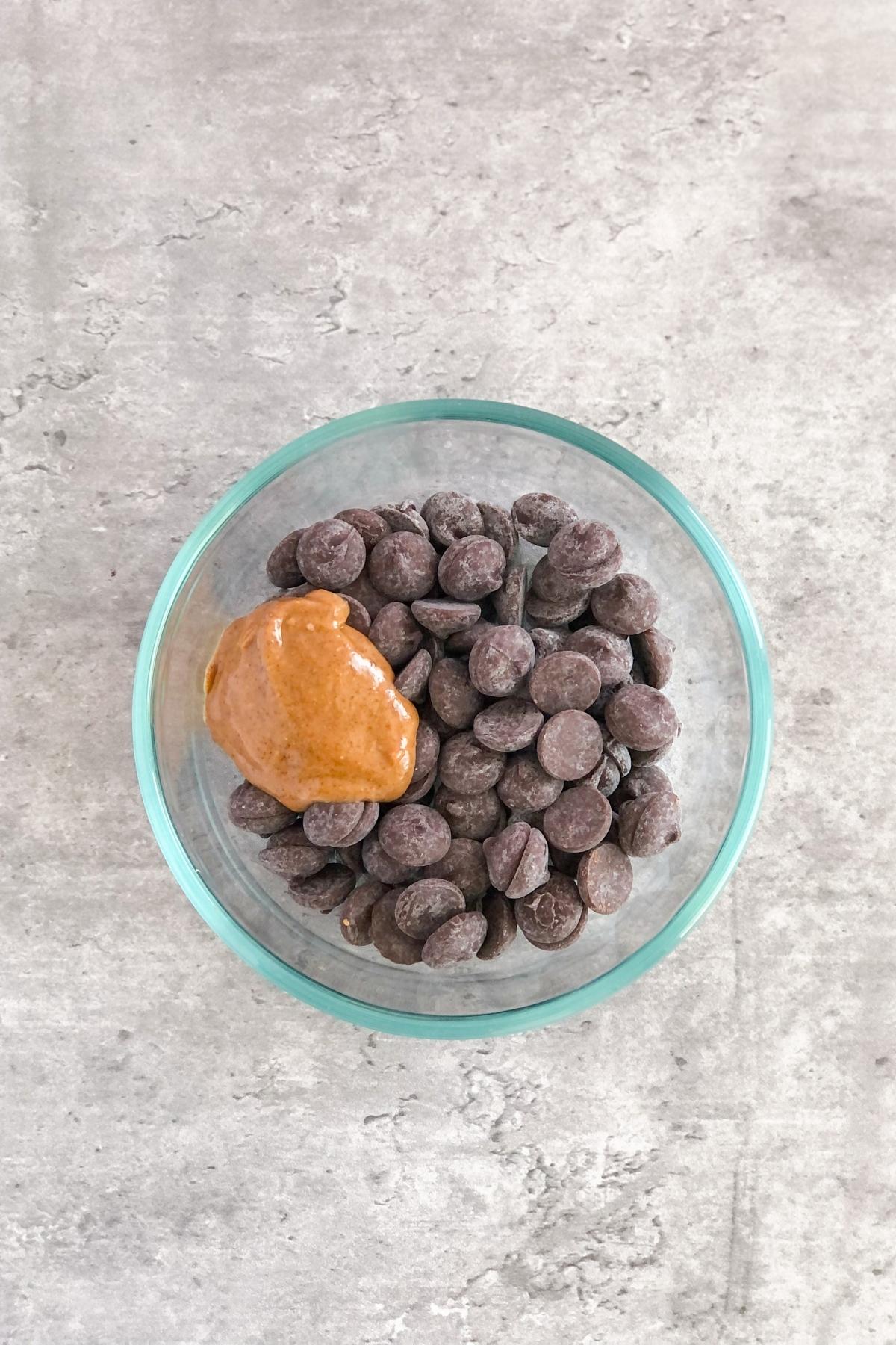 dark chocolate chips with a dollop of almond butter in a bowl