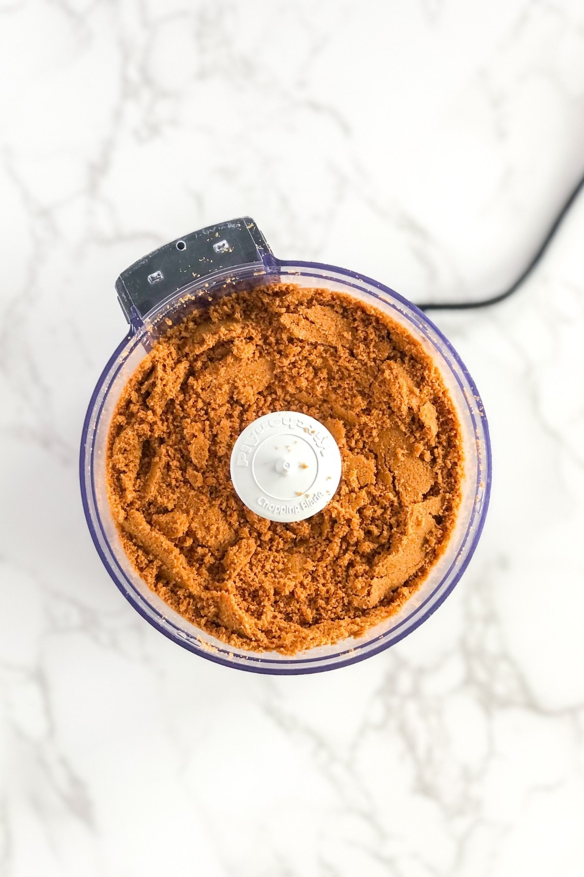 crushed Biscoff cookies in a food processor