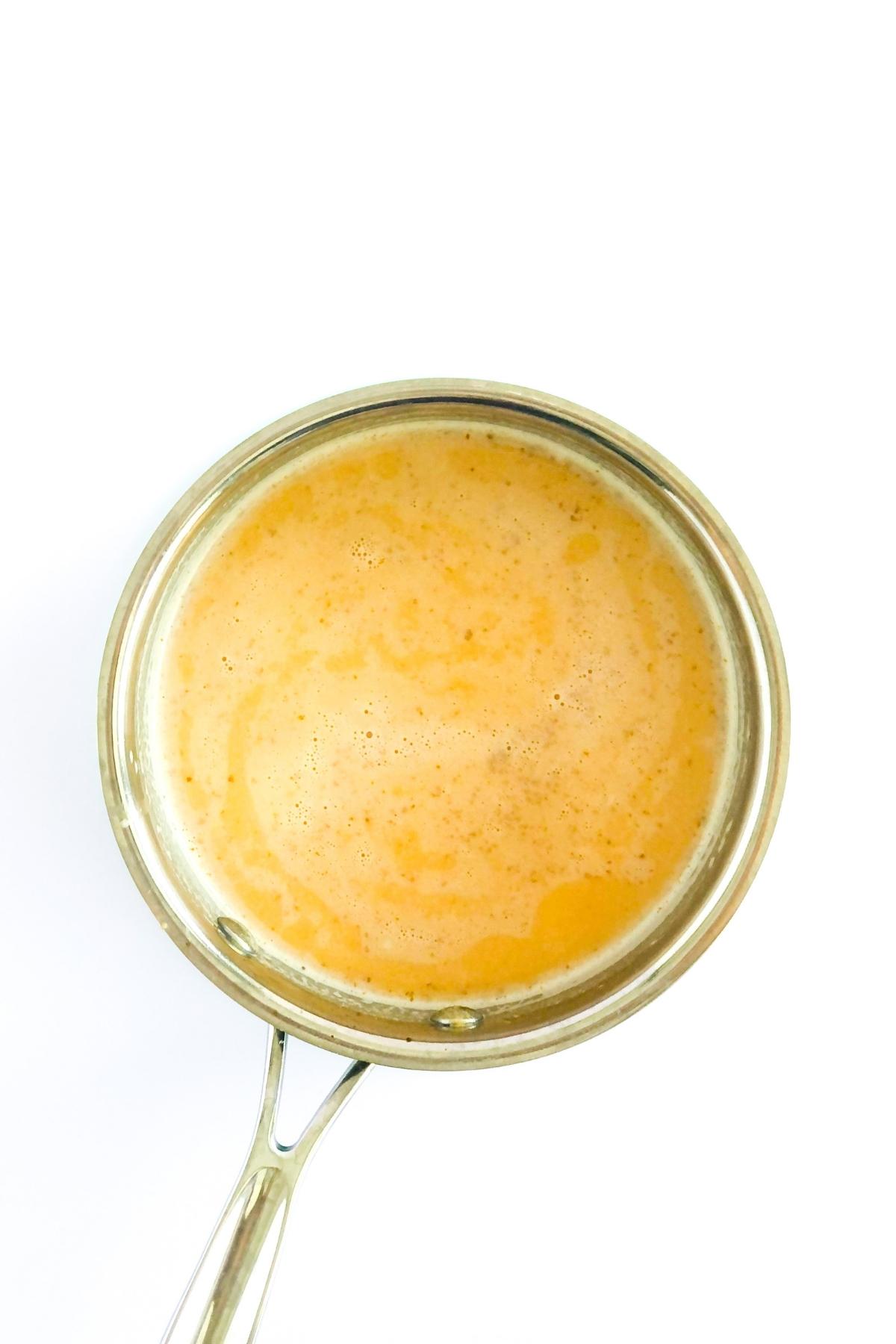 pumpkin panna cotta mixture in a saucepan