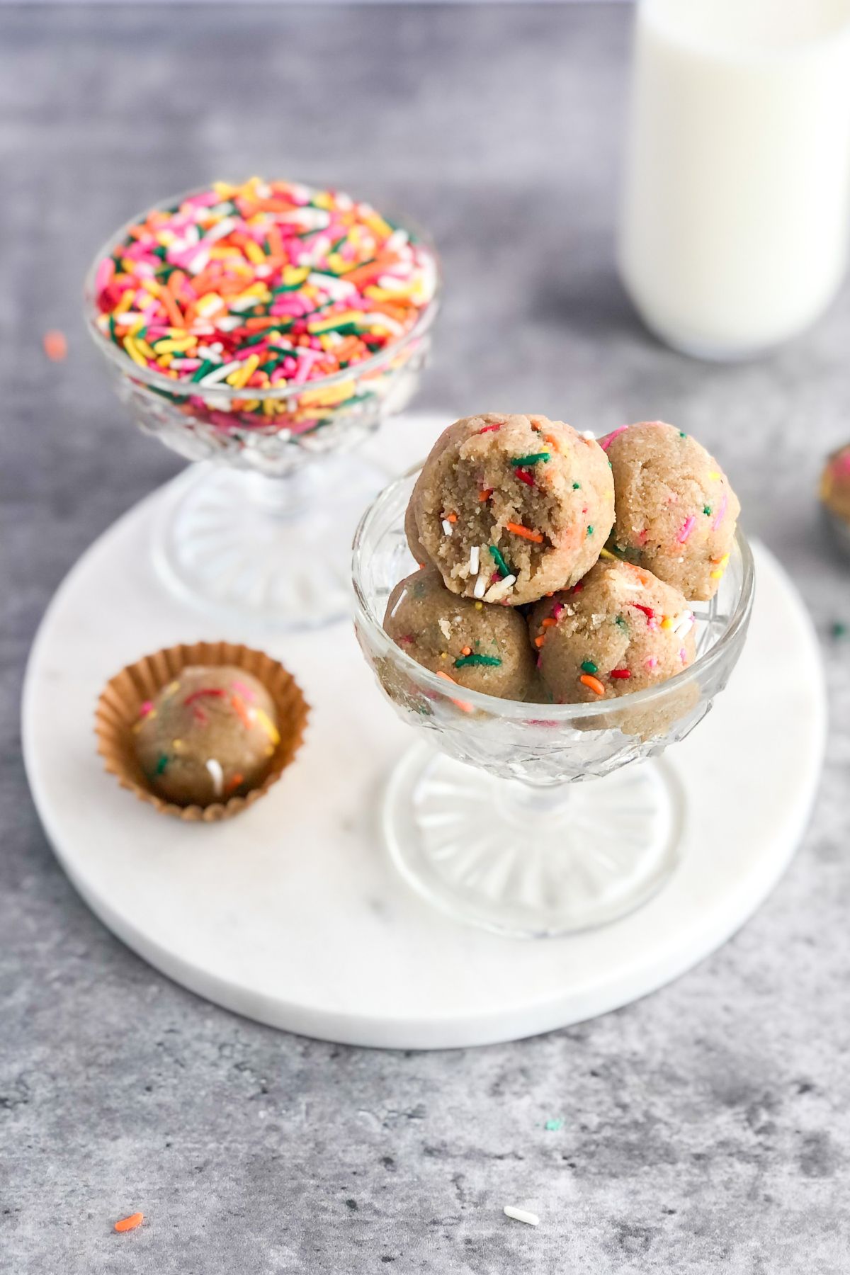 no bake cookie dough with sprinkles in a white marble platter