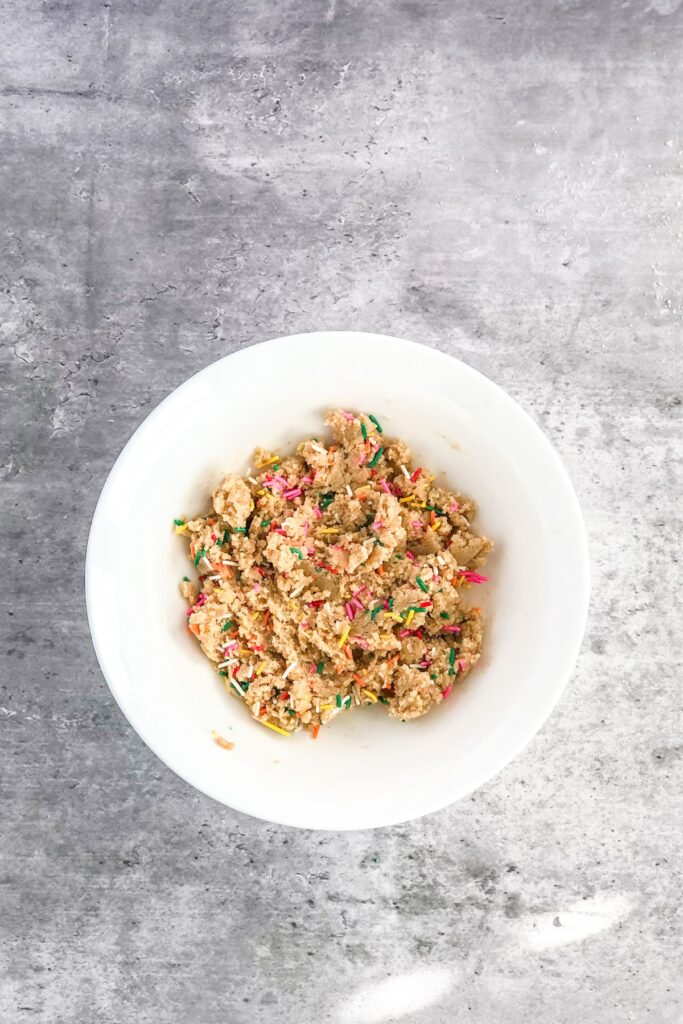 edible sugar cookie dough with sprinkles in a bowl