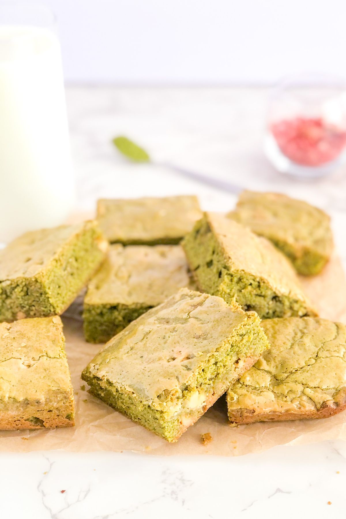 matcha blondies with white chocolate chips on parchment paper
