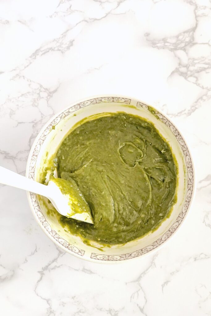 green blondie dough in a large bowl with a spatula